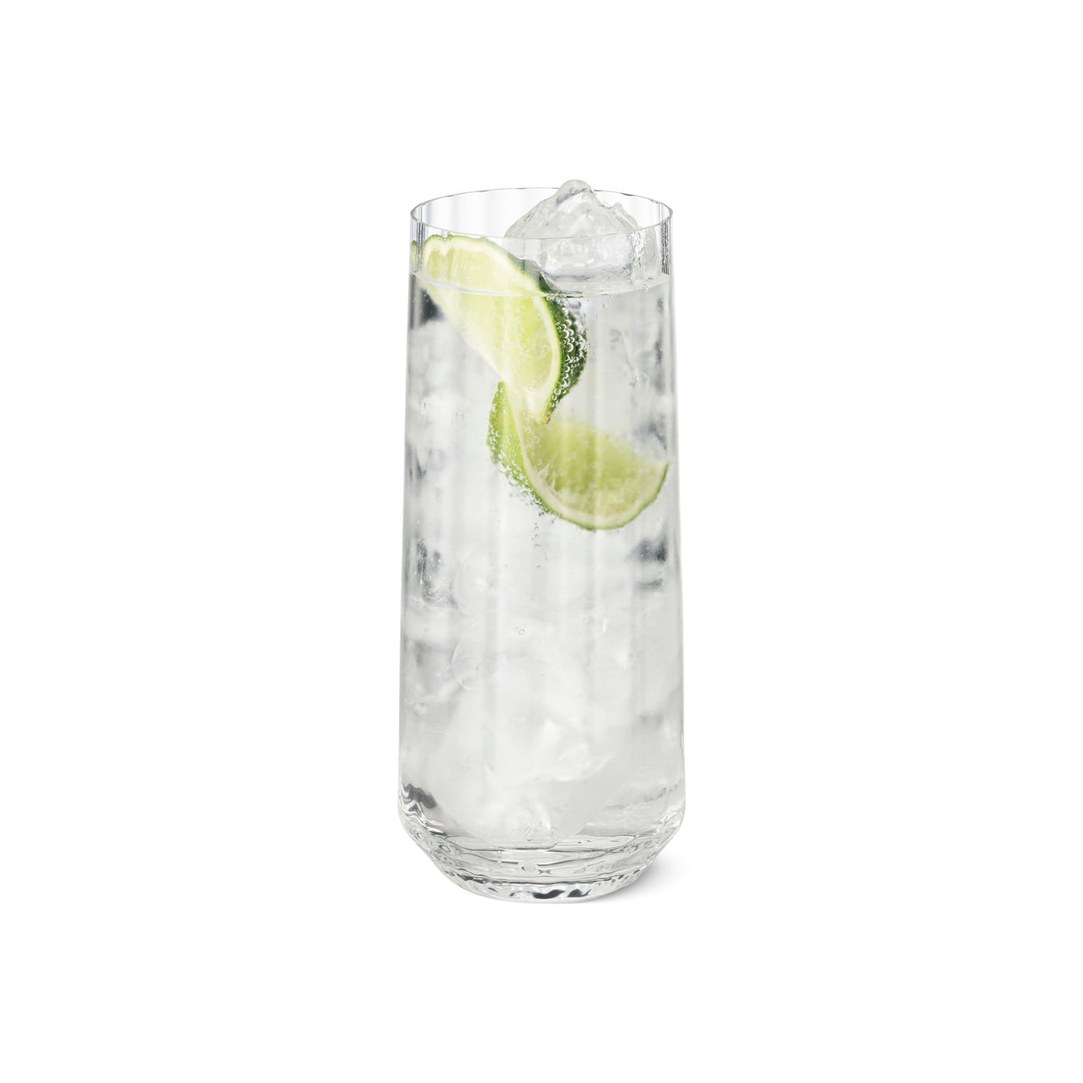 Straight-on view of Bernadotte Highball Glass (45 cl) filled with ice and lime wedges on white background