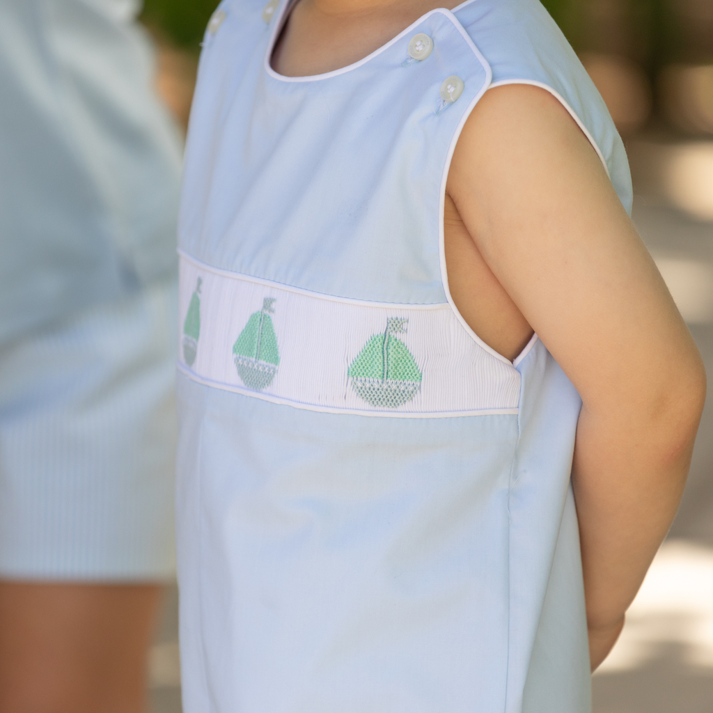 Henry Duvall Jennings Jon Jon in Bailey’s Bay Blue cotton with hand-smocked sailboats, classic heirloom baby boy summer outfit
