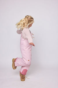 Kids light pink snow bib pants with adjustable straps, waterproof fabric, and reinforced knees for winter play and ski for girls