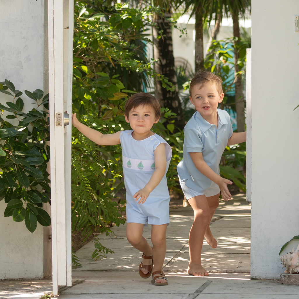 Henry Duvall Jennings Jon Jon in Bailey’s Bay Blue cotton with hand-smocked sailboats, classic heirloom baby boy summer outfit