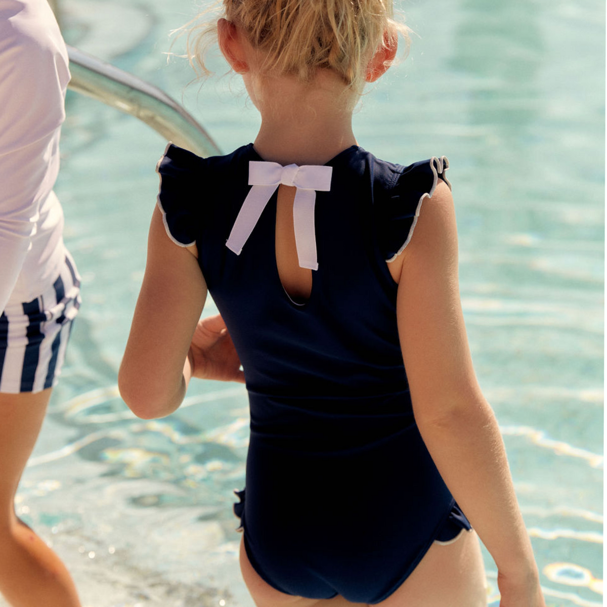 Girls Navy With White Trim Ruffle Sleeve Rashguard One Piece