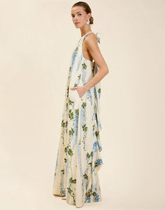 Adelina Gown in Wisteria Toile stretch crepe with halter neckline, cascading bow back detail, A-line silhouette, and hidden side pockets.