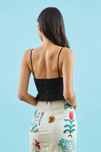 The Chrissy Top is a sleek spaghetti-strap camisole with a seamed bust and a back zipper.