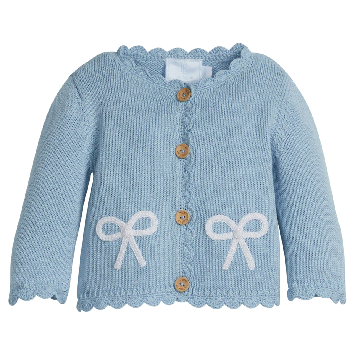 Little English traditional children's clothing.  Baby girl's blue with white bow crochet cardigan sweater for Spring.  Gift clothing for baby girl