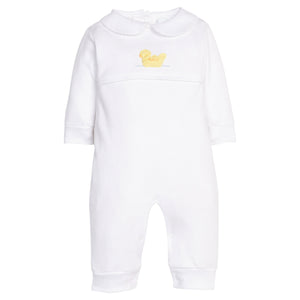 Little English traditional children's clothing.  Classic white cotton playsuit with peter pan collar and yellow crochet duck for baby