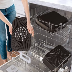 Close-up of Foodi Smart XL indoor grill and air fryer removable grill plates being placed in a dishwasher to show dishwasher-safe parts