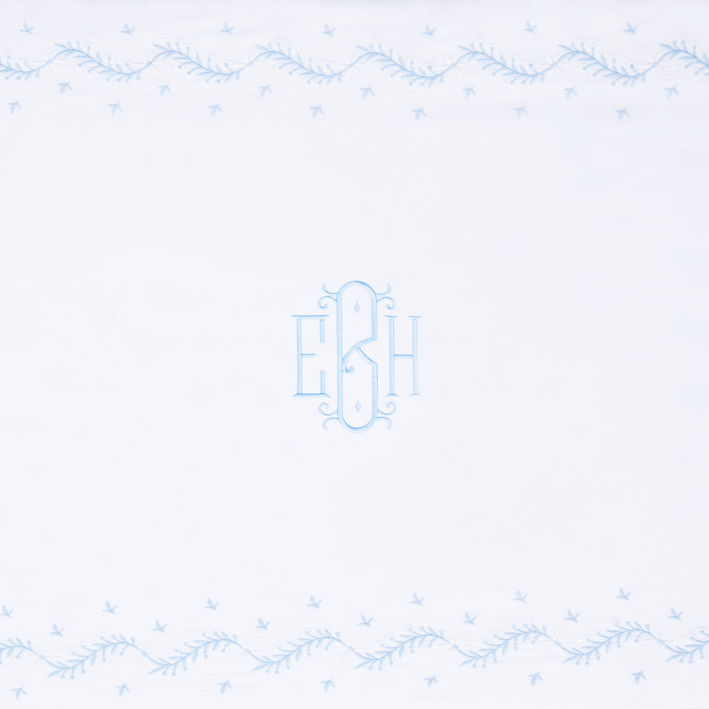 Little English classic nursery goods for baby, white crib sheet with simple light blue embroidery along the edges for baby