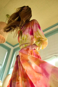 Cropped long sleeve top in yellow and pink tie-dye print with elastic at the sleeves