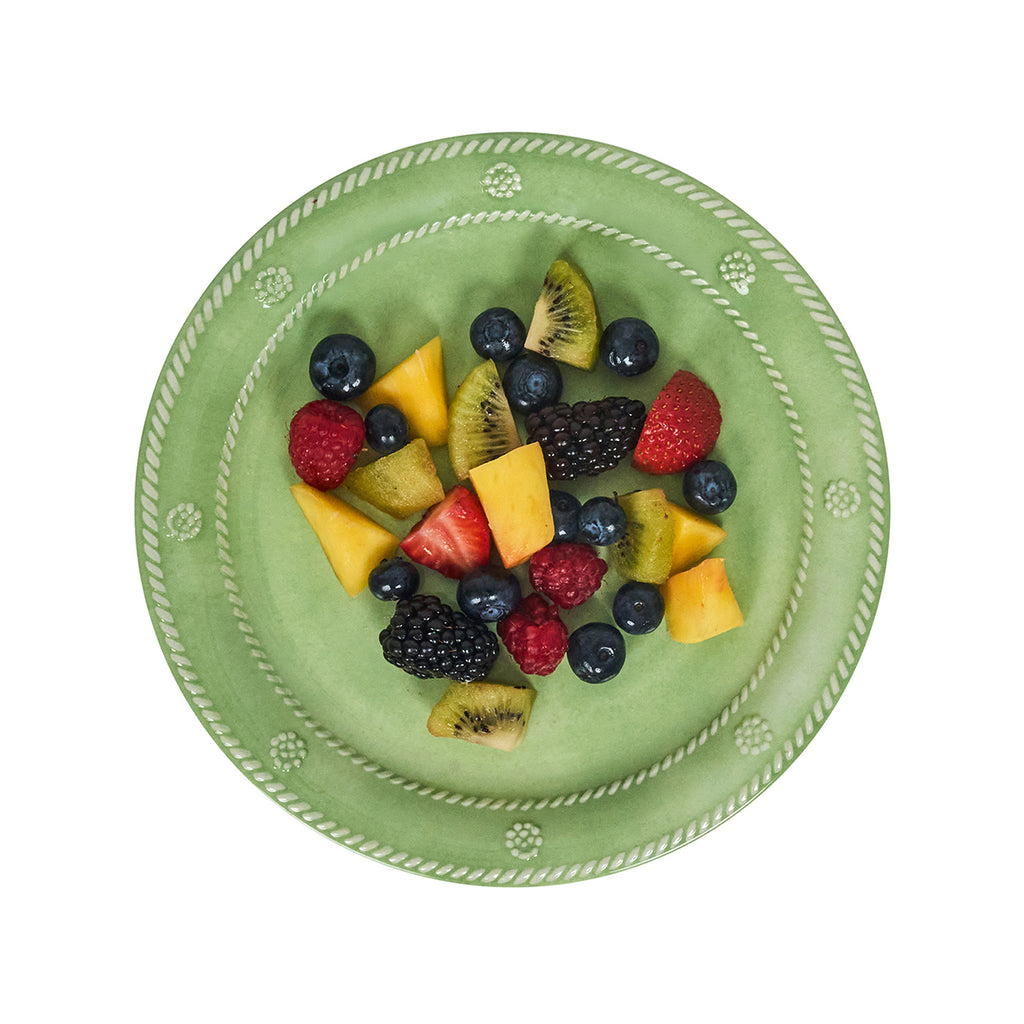 Top-down view of Berry & Thread melamine dessert plate in seagrass showing embossed rope-and-berry rim and seasonal fruit on a white background