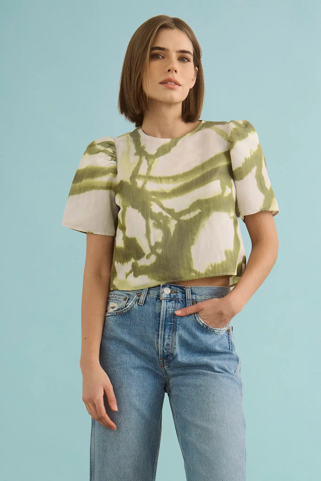The Olivia Top in Seabreeze Ikat Green with denim.
