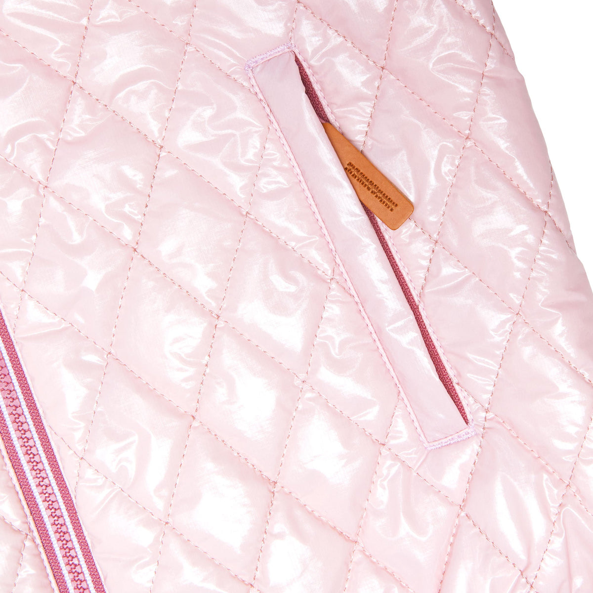 Girls and women shiny light pink puffer jacket for fall and winter, designed as a warm in-between layer with removable hood, insulated core, and water-resistant fabric