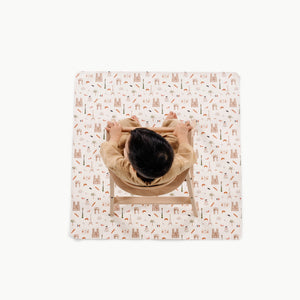 Paris@overhead of kid in a highchair on the paris mini mat