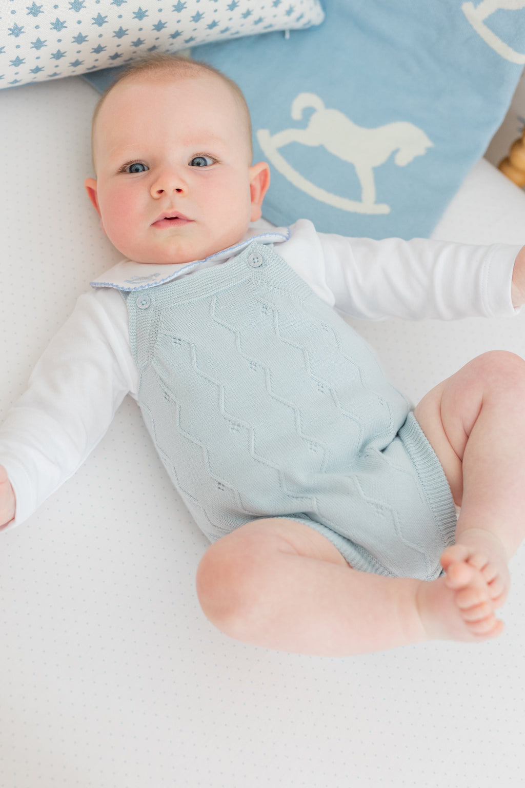little english classic children's clothing baby boys light blue pointelle knit bubble with pinpoint onesie with rocking horse motif. Pima crib sheet in blue micro dot, for baby boy
