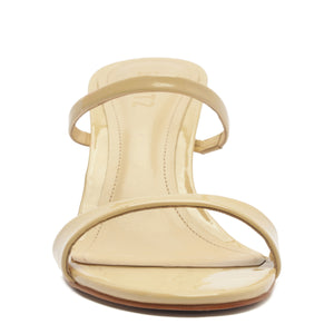 Front view of Jessica Mid Mule patent sandal in Natural Nibs showcasing two slim patent straps and open toe on white background
