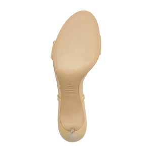 Bottom view of Jessica Mid Mule patent sandal showcasing smooth beige sole and toe post on white background