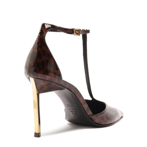 Rear three-quarter view of Allure T patent pump showcasing brown tortoiseshell patent upper, gold stiletto heel, and T-strap on white background