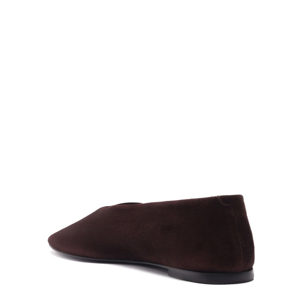 Rear three-quarter view of Courtney suede flat in seal brown showcasing squared toe and low heel on white background