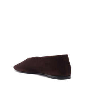 Rear three-quarter view of Courtney suede flat in seal brown showcasing squared toe and low heel on white background