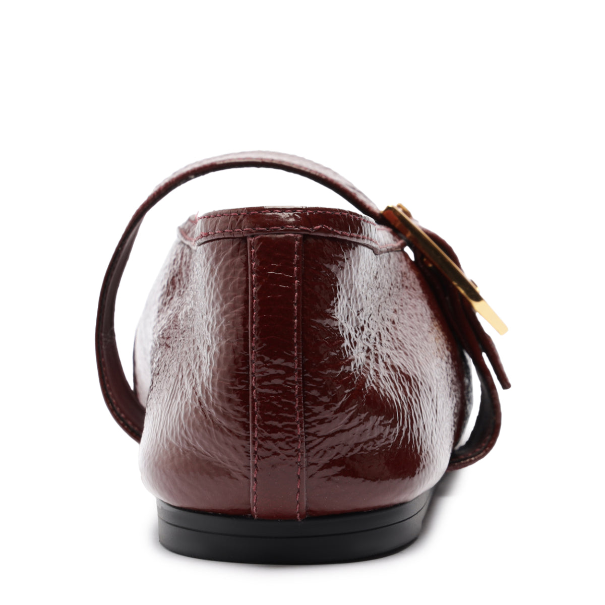 Rear view of Courtney Buckle patent flat in Vino showcasing patent leather heel and gold buckle strap on white background