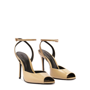 Three-quarter view of Estella patent pump in Natural Nibs with glossy peep toe, ankle strap and stiletto heel