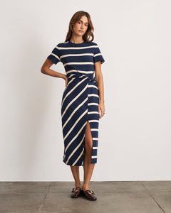 Front view of Short Sleeve Striped Cody Dress in maritime blue and cream showcasing twist-knot waist and side slit, fitted midi on model