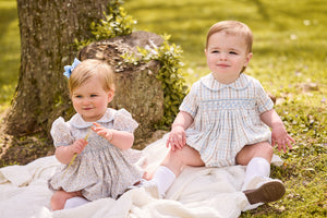 little english classic children's clothing baby light blue, cream, and light tan floral bubble for girl and plaid for boy with peter pan collar, chest smocking, and embroidery, for fall 
