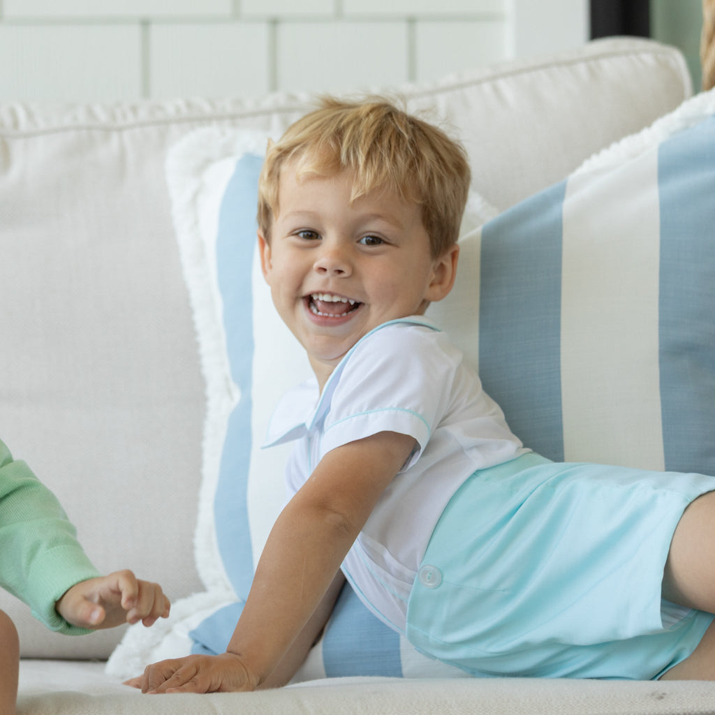 Toddler boy wearing the Henry Duvall Benjamin Button-On, a traditional heirloom-style outfit designed for special occasions and family photos.