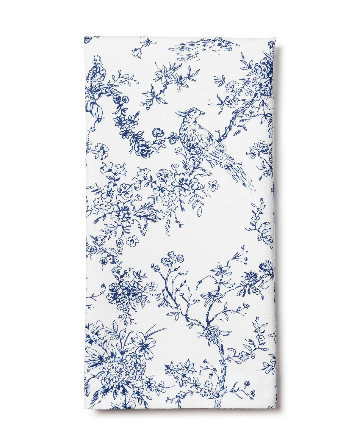 Folded front view of Signature Twill napkin showcasing navy blue toile bird and floral print on white background