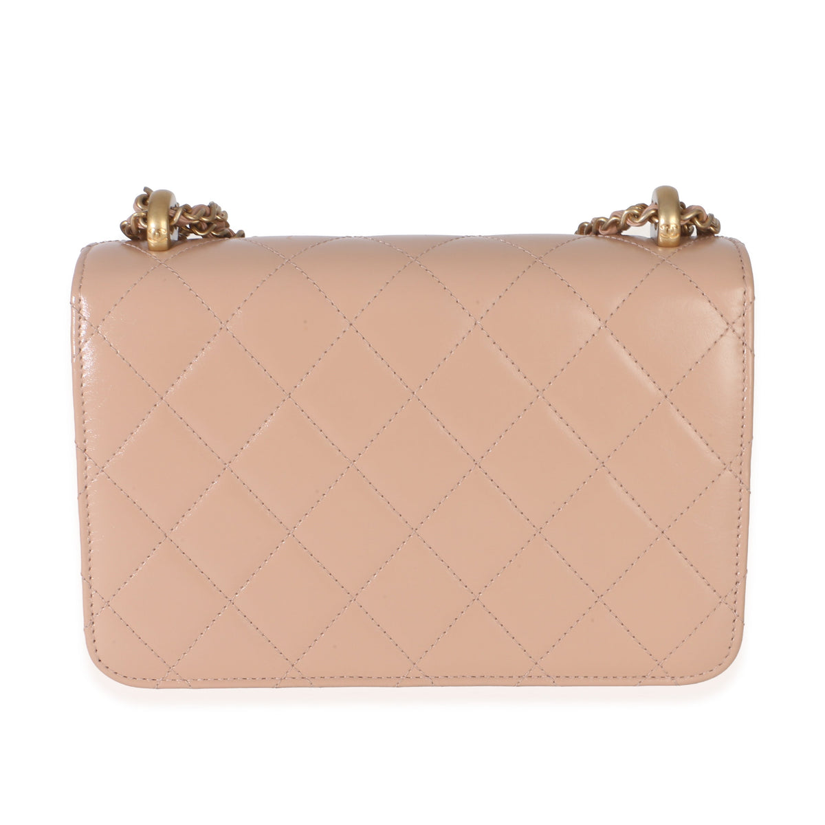 Back of Chanel Mini Perfect Fit Flap Bag showing beige quilted calfskin and gold tone chain strap on white background