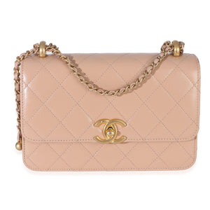 Front view of Chanel beige quilted Mini Perfect Fit Flap Bag with gold CC turnlock and leather-woven chain on white