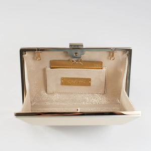 An open, empty beige Bella Rosa bag with a metallic clasp and a small interior pocket featuring a Personalized Plaque Sentiment Engraving from The Bella Rosa Collection.