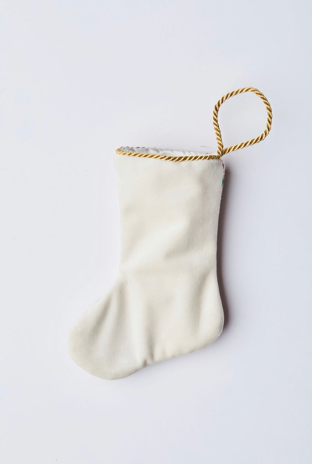Back view of Bon Appetit Macarons needlepoint stocking with solid white velvet backing