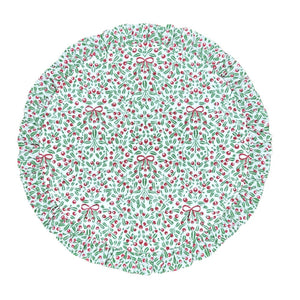 Round quilted placemat with Christmas-themed pattern on a white background