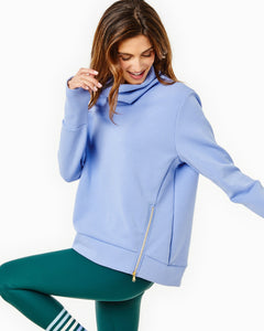Model is wearing the Everyday Pullover in Violet and the Everyday Legging in Ivy