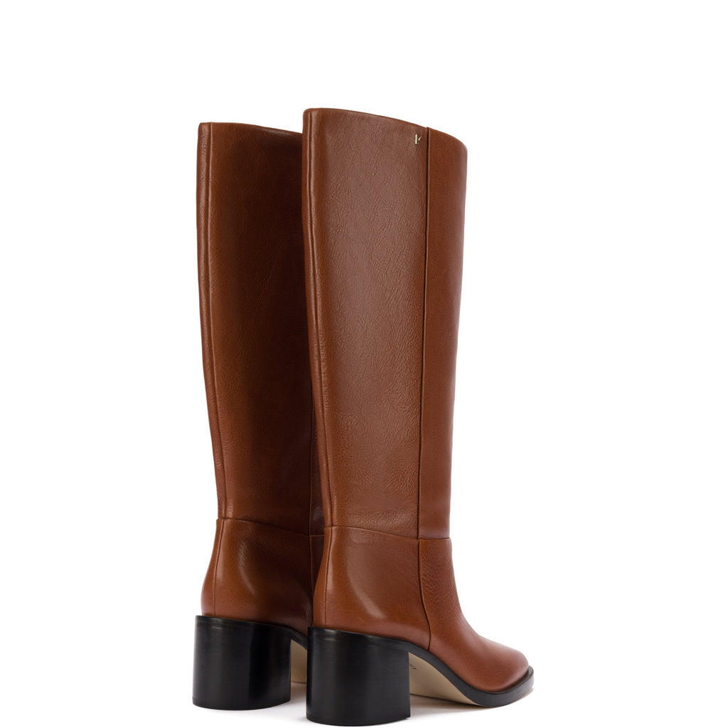 Rear three-quarter view of Ricky Boot in mocca leather showcasing black block heel and tall knee-high leather shaft on white background