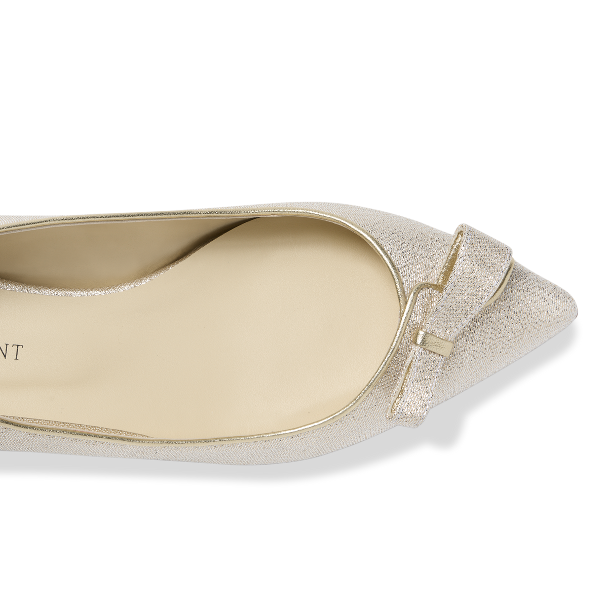 Top view of Natalie pointed-toe flat in champagne lame showing bow detail and metallic shimmer on black background