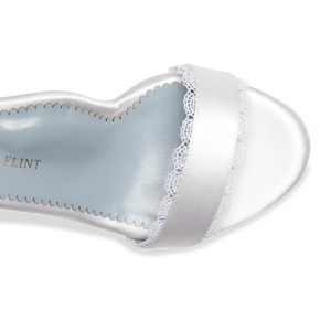Stylish and comfortable, the Perfect Block Sandal 60 in Wedding White Satin features a 60mm block heel, arch support, and adjustable ankle straps.