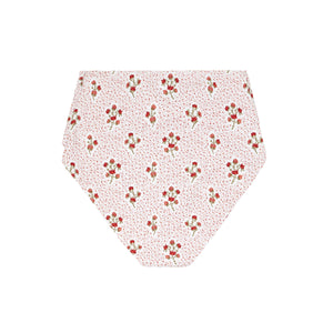 Flat lay of women’s high-waist bikini bottom showing white fabric with small raspberry-red floral print on white background